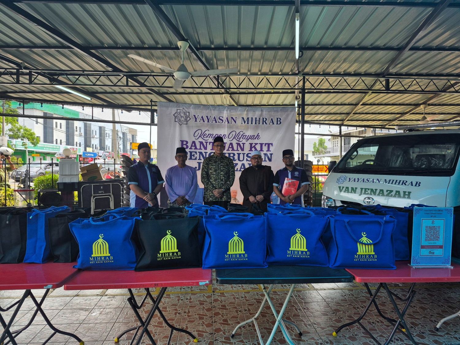 Program komuniti Kempen Kifayah dengan beg set kain kafan